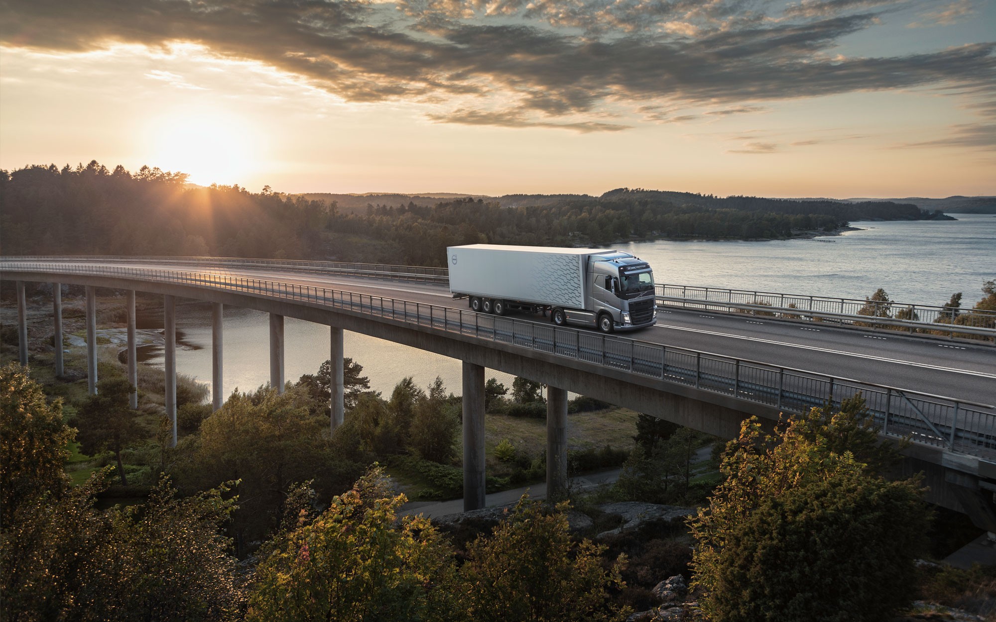 Volvo truck crossing a coastal bridge